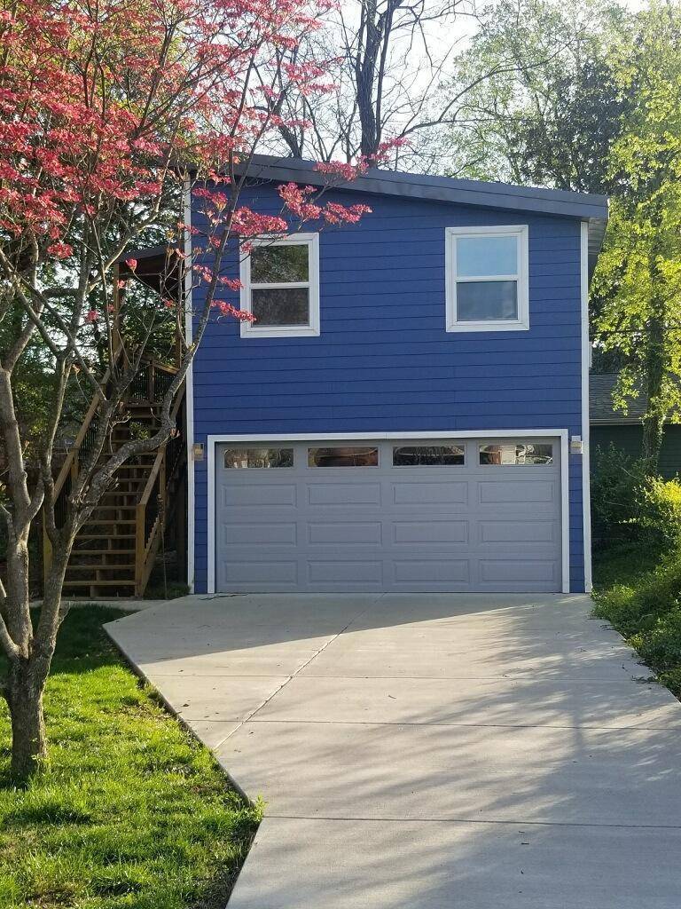 carriage house behind home photographed in spring