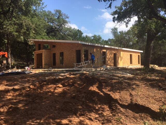 MSH 20170817 texas modern custom stone brick outdoors construction SI Ps ladders workers left side rear view PX min