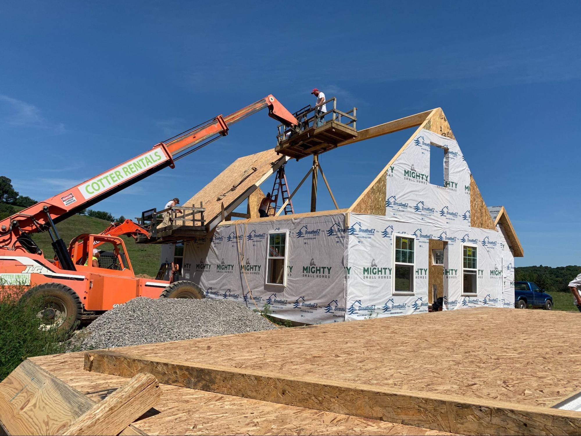 MSH 20191023 pulaski tennessee tn cottage outdoors construction waterproofing WIP equipment bucket workers gravel left side view PX min