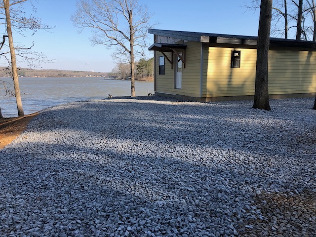 MSH 20200214 outdoors finished yellow paneling gravel Winter wide shot PX