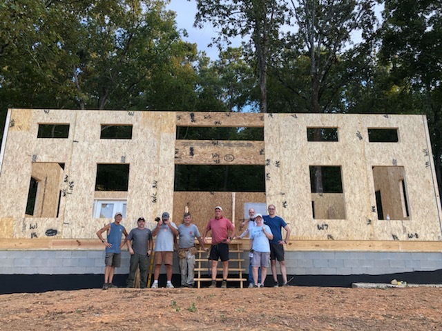 MSH 20220423 outdoors construction Spring workers group shot front side view SI Ps no roof foundation PX