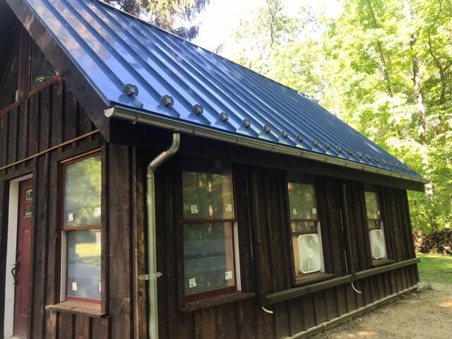 MSH 20230612 rural suburb New York City outdoors finished blue roof brown paneling right side view PX min