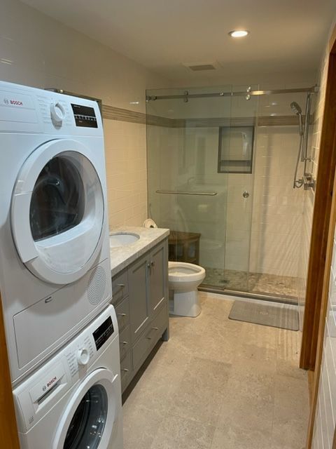MSH 20230707 rural suburb New York City indoors finished bathroom laundry machines medium shot white tile PX min