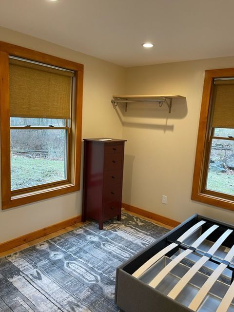 MSH 20230707 rural suburb New York City indoors finished bedroom medium shot bed frame windows PX min