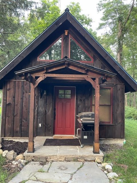 MSH 20230707 rural suburb New York City outdoors finished brown paneling front view door PX min