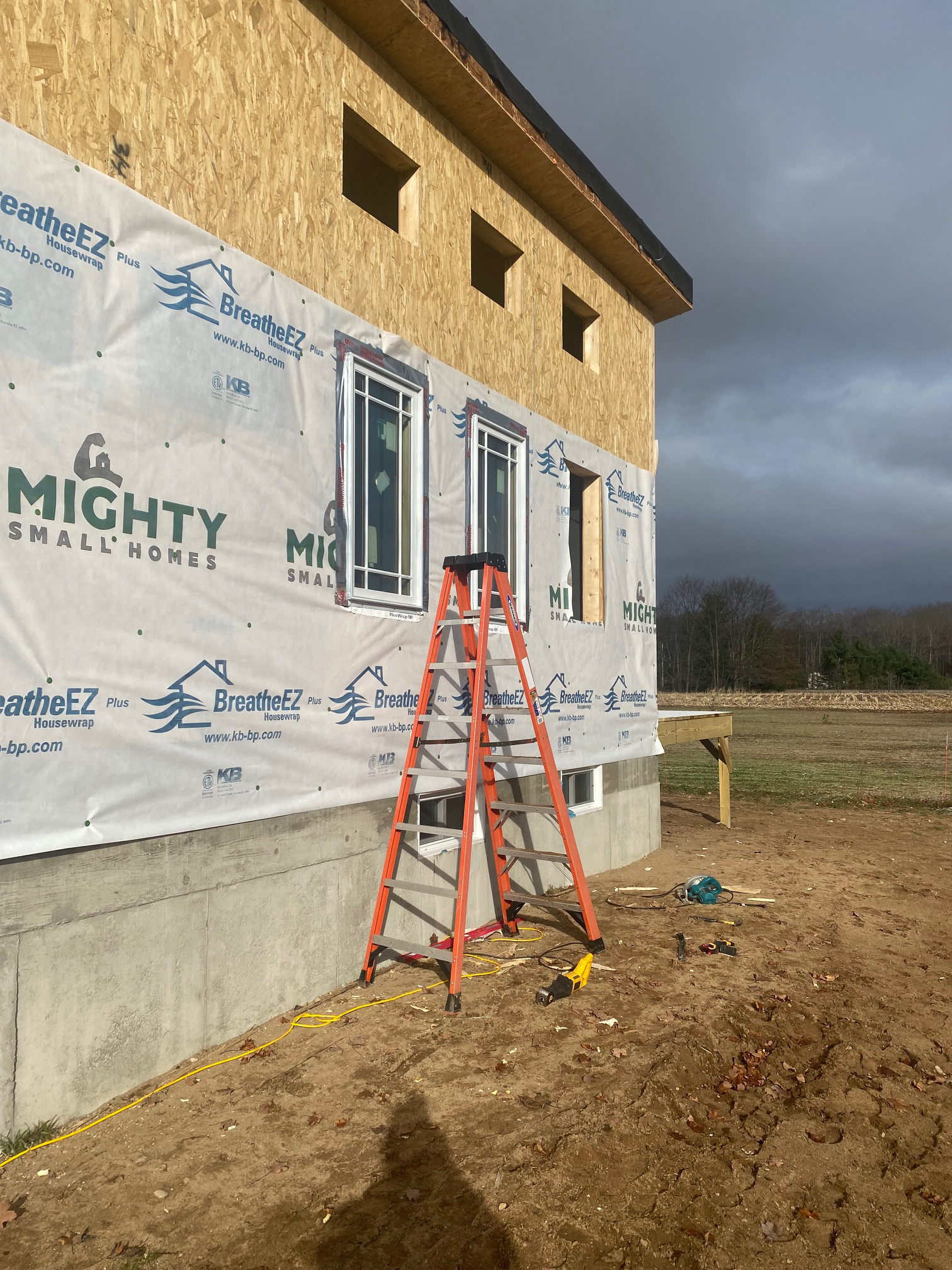 Side view of Michigan Modern customer build with windows and house wrap installed