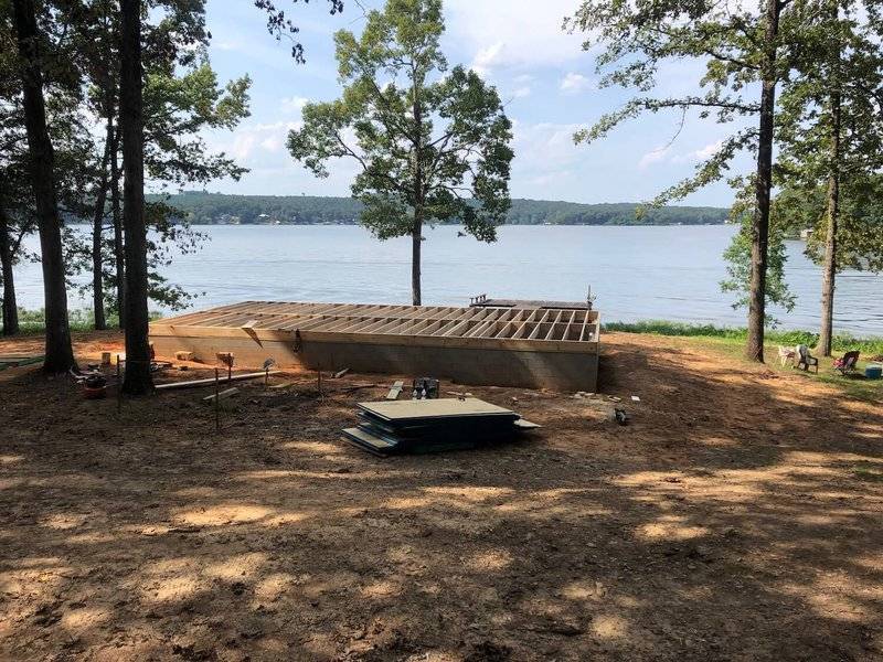 photo of a crawl space foundation in early stage construction on the shore of a lake