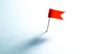 Red flag on pin illustrating warnings