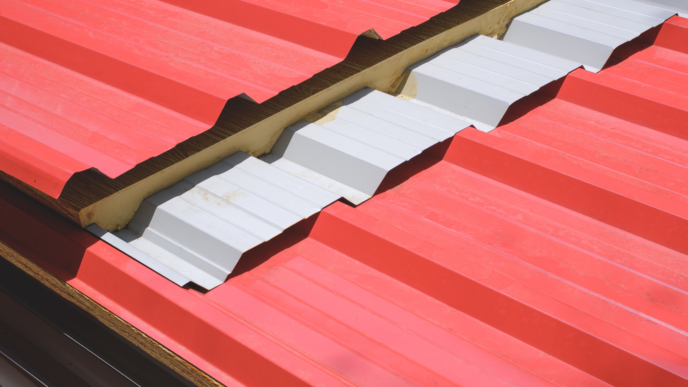 cutaway overlapping ridges of corrugated metal roofing