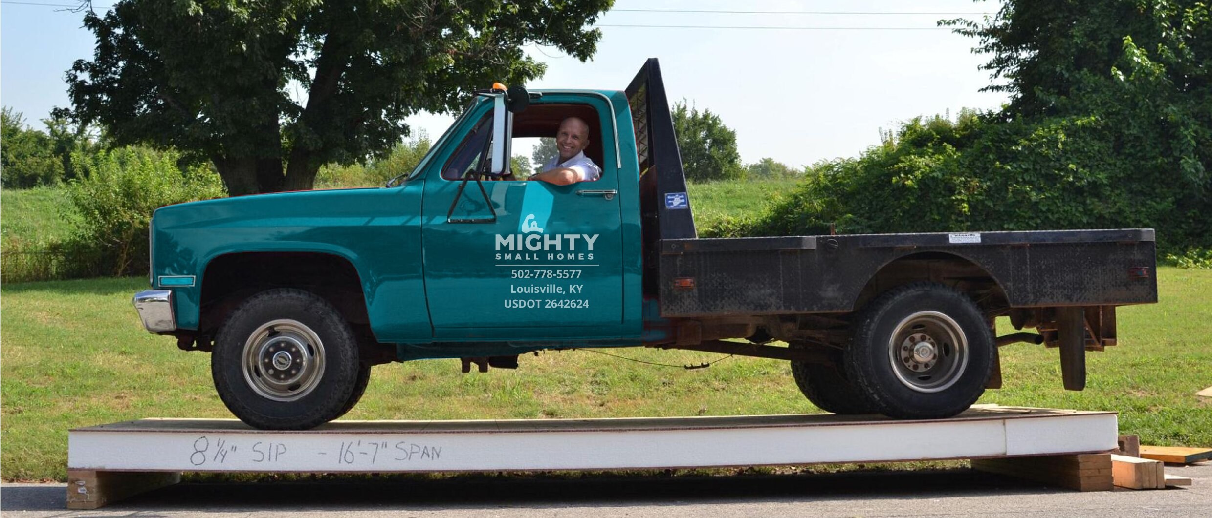 pickup truck parked on a raised sip panel to demonstrate load strength