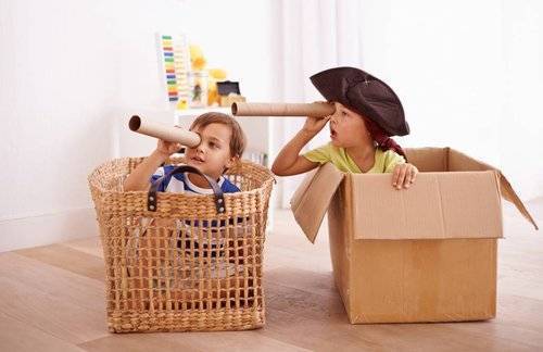 kids playing in boxes as pirates