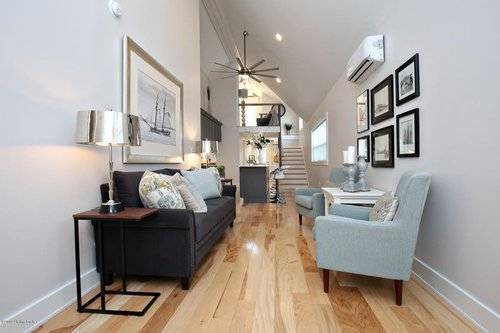 cottage living room with stairs in the background leading to loft space.jpg