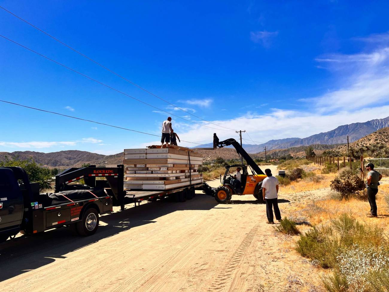 panels and materials arrive by truck on morongo valley