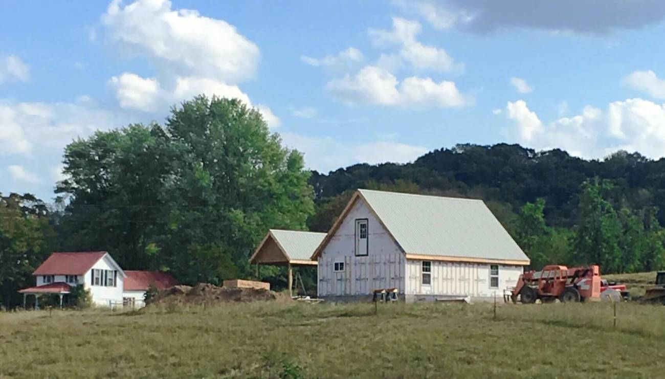 A rear-view photo of an MSH Cottage and surrounding area