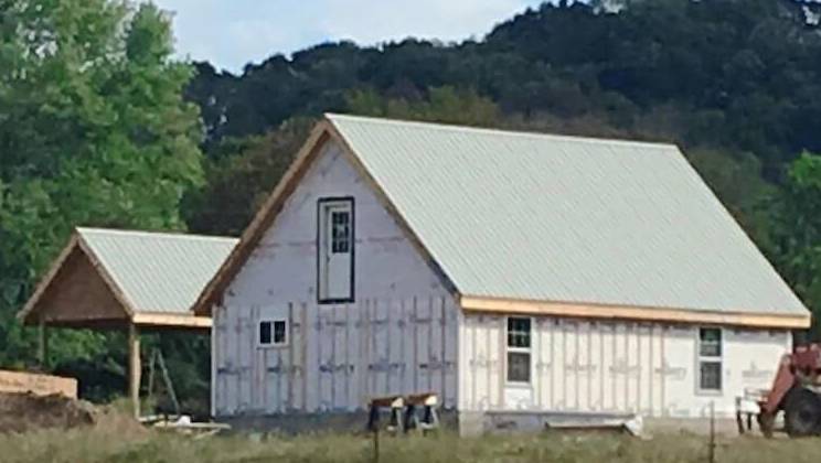 A rear-view photo of an MSH Cottage in house wrap