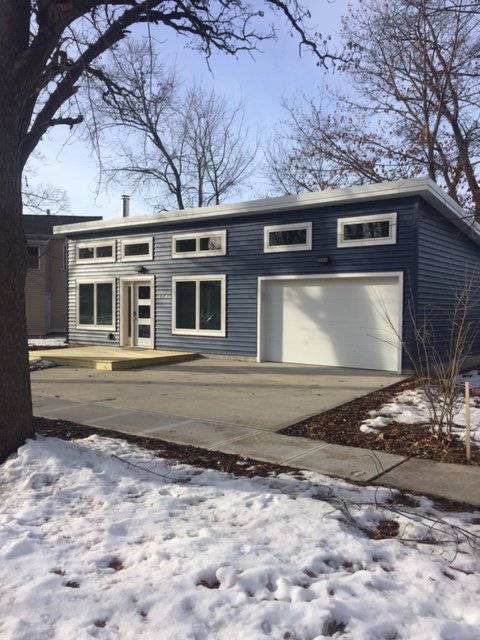 Photo of a 600 Modern with attached garage during winter