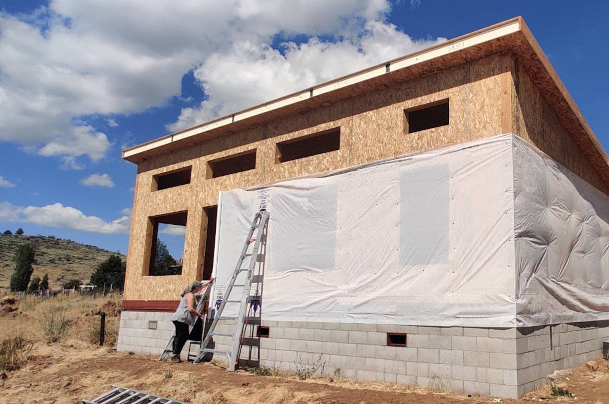 Image of house wrap being installed