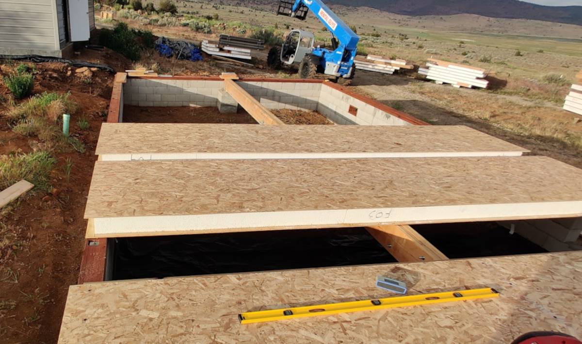 Image of SIPs floor panels laid out for installation