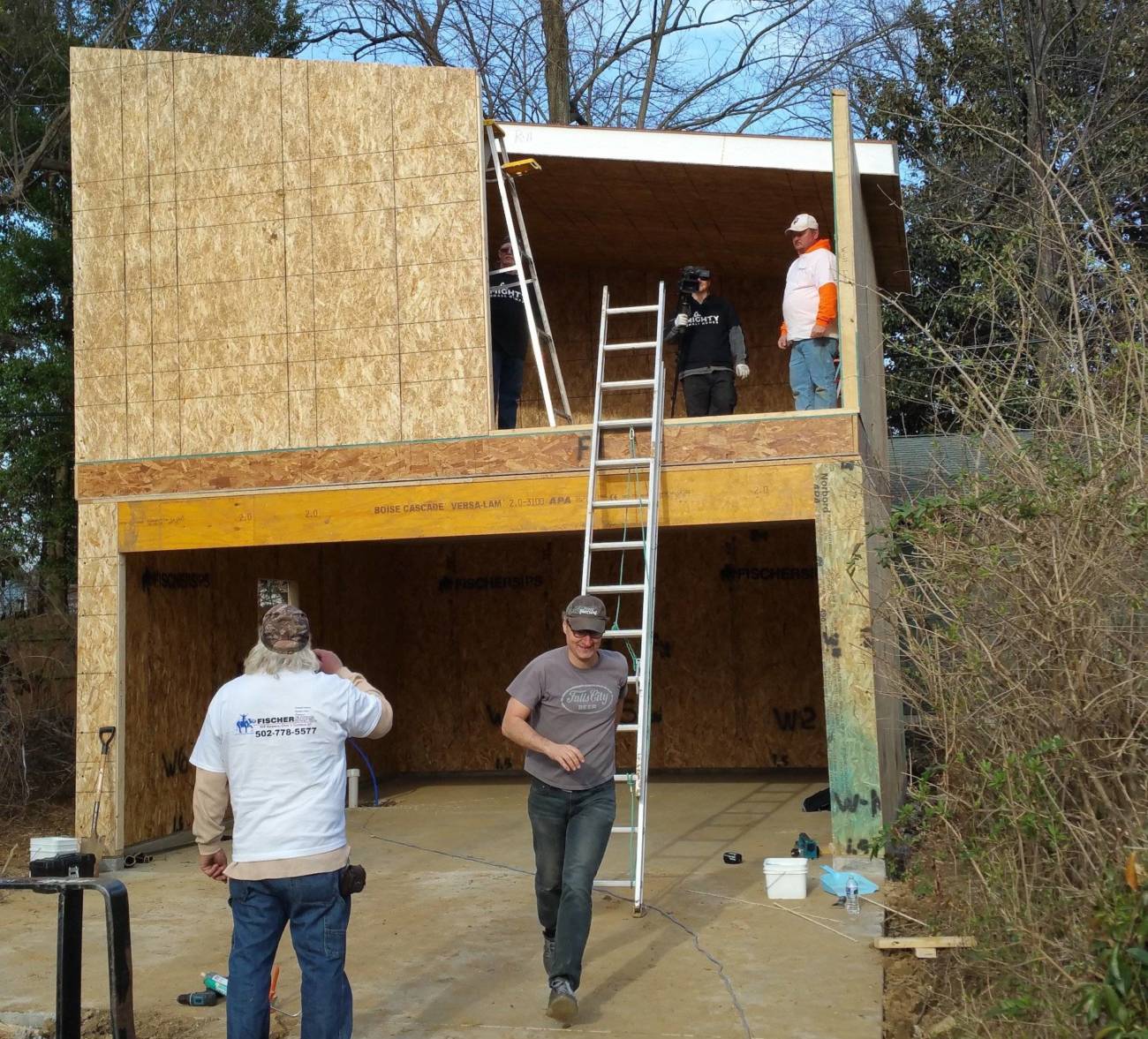 Image of house before the last wall panel is set in place