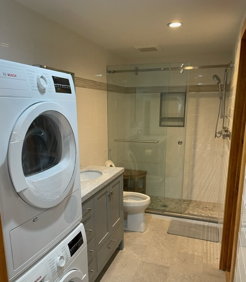 Photo of Yorktown Heights cottage bathroom with space saving washer and dryer