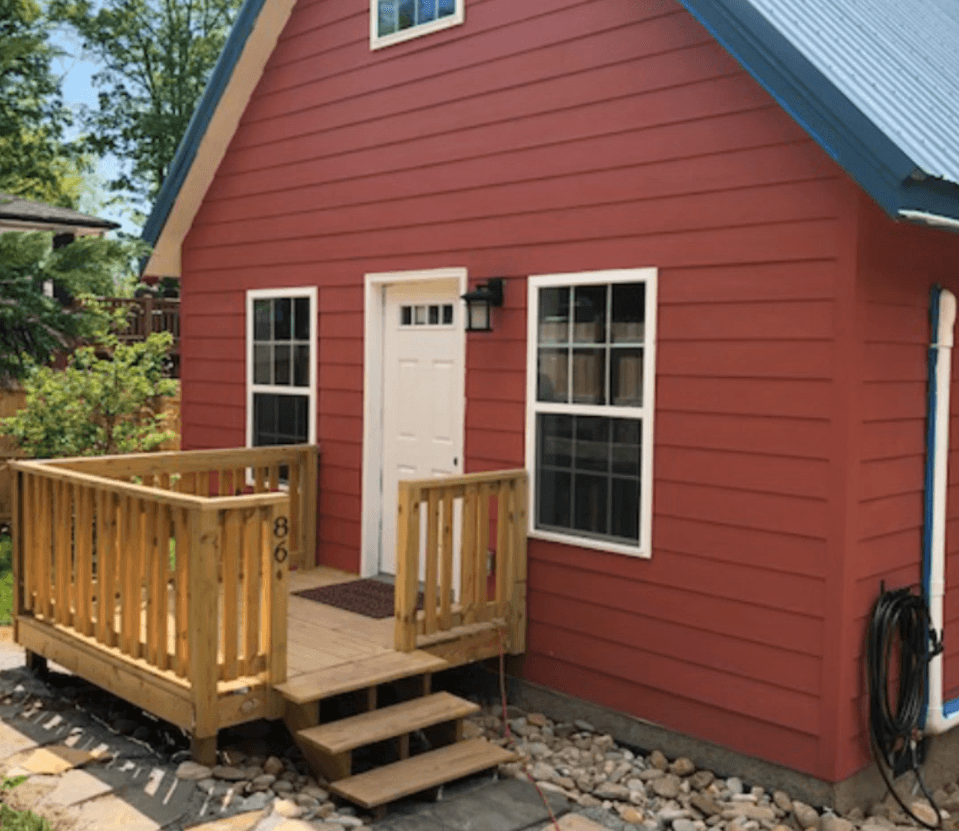 Photo of a Cottage with primer on the siding