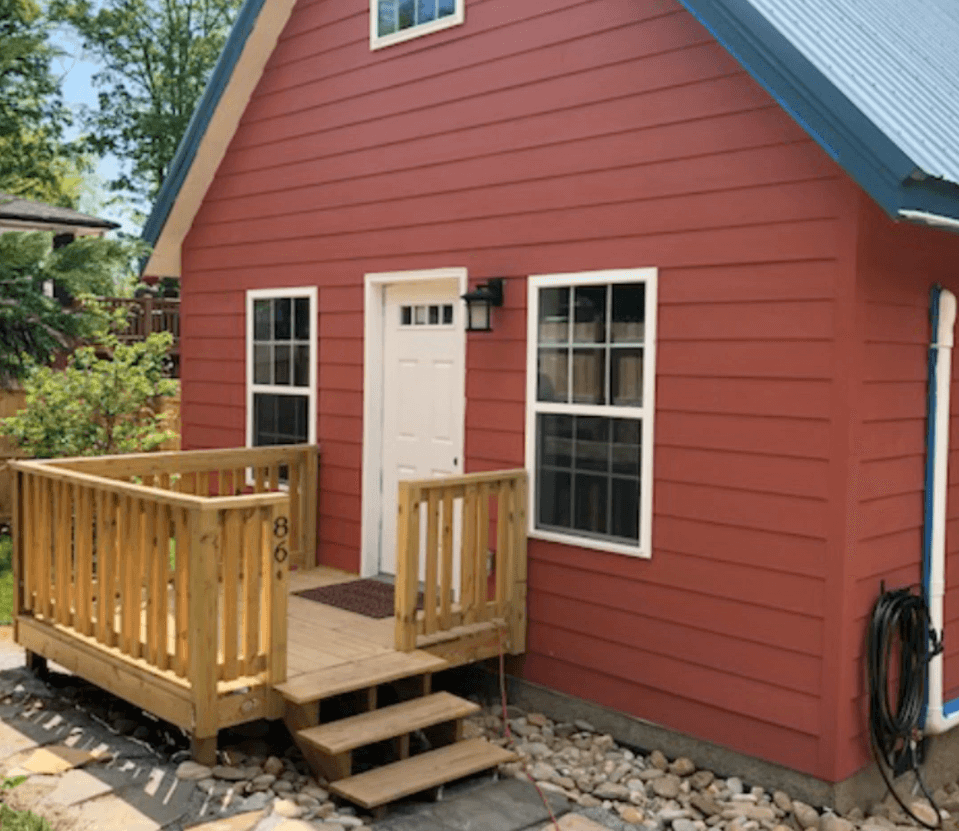 Photo of a Cottage with primer on the siding