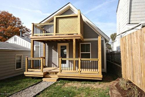 cottage home with lower deck and upper deck out of the loft