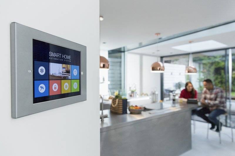 Photo of smart home touch screen on a kitchen wall