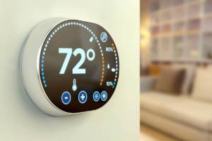 touch screen display for smart home thermometer concept on a wall